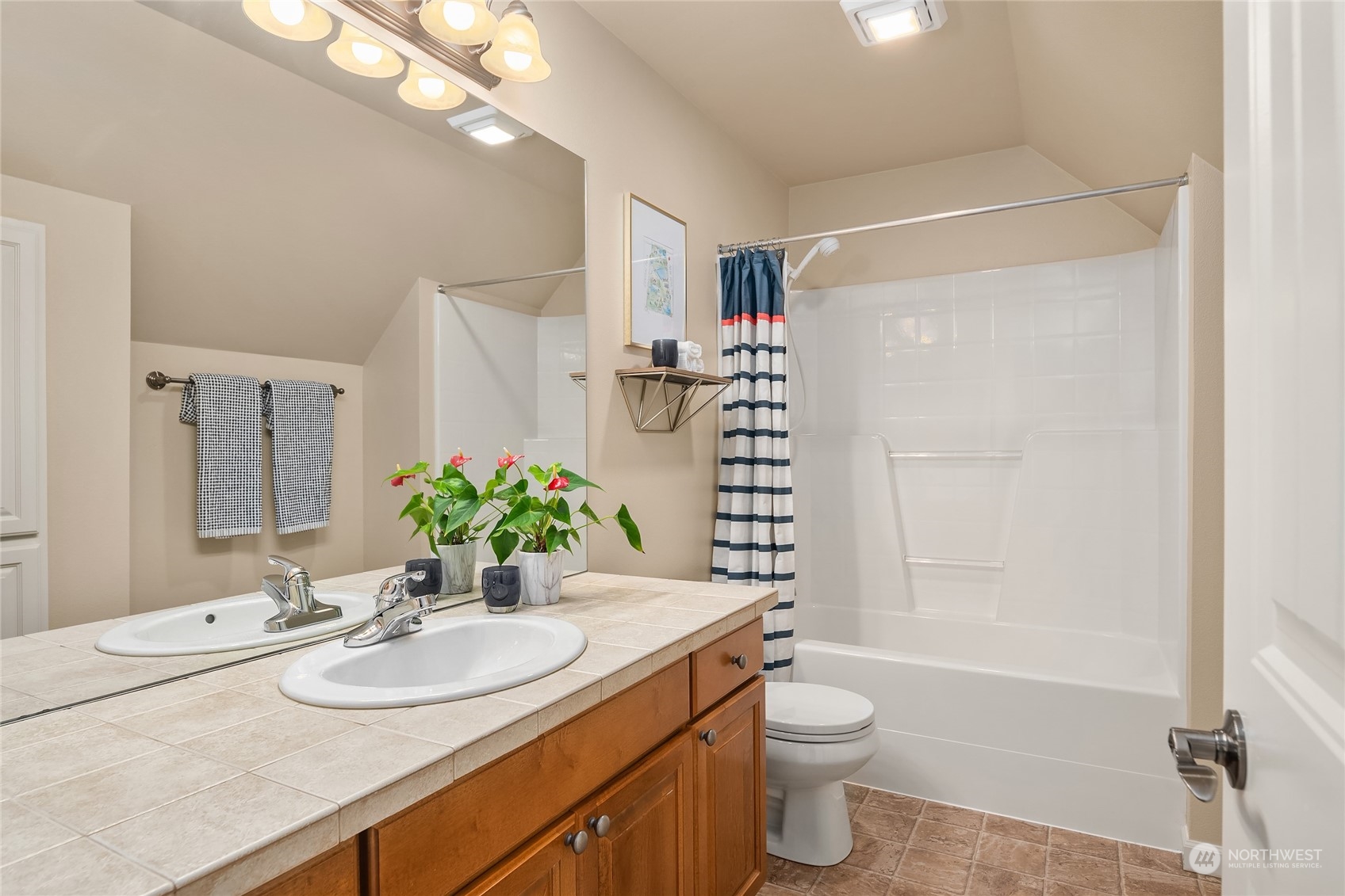 818 235th Place Southeast Bothell, WA 98021 - Photo 24 of 31 a bathroom with a granite countertop sink toilet and shower