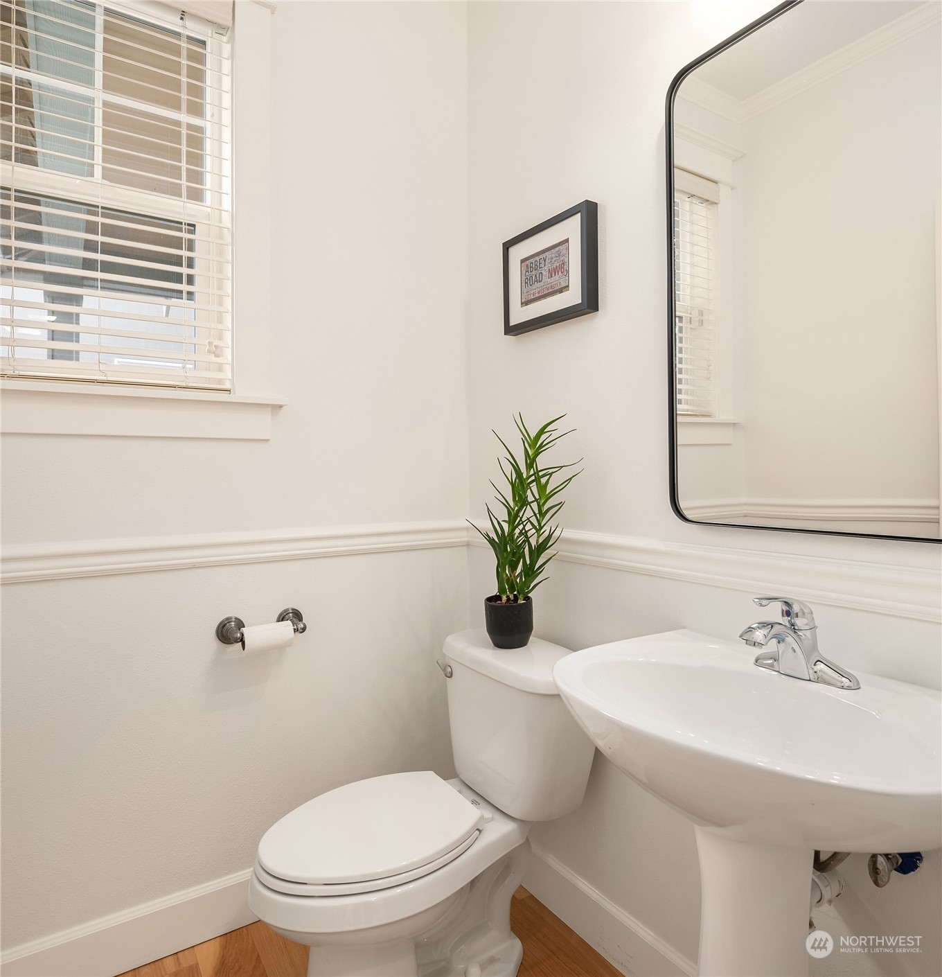 818 235th Place Southeast Bothell, WA 98021 - Photo 5 of 31 a white toilet sitting next to a bathroom sink