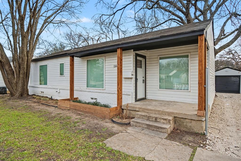11446 Lippitt Avenue Dallas, TX 75218 - Photo 2 of 26 a front view of a house with garden