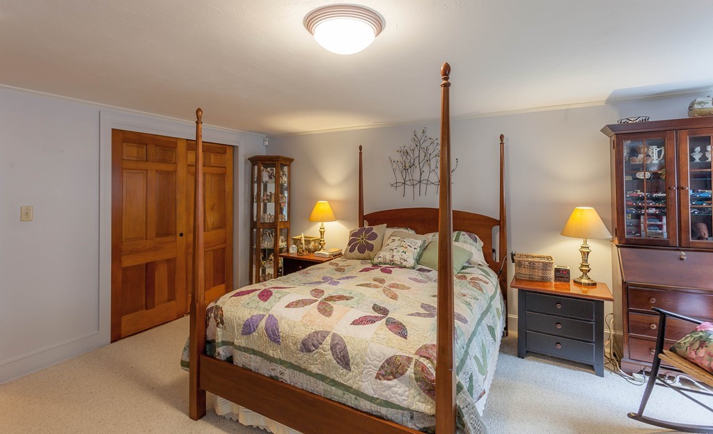 336 Mendall Road Acushnet, MA 02743 - Photo 24 of 30 a bedroom with a bed a table and painting on the wall