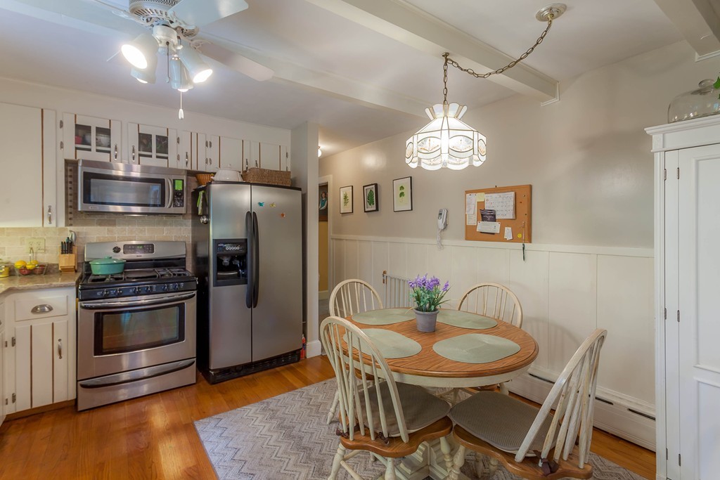 336 Mendall Road Acushnet, MA 02743 - Photo 7 of 30 a view of a dining room with furniture a chandelier and wooden floor