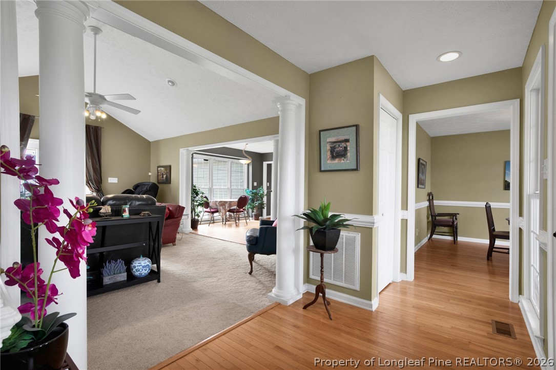 73 Timberlake Drive Clinton, NC 28328 - Photo 11 of 37 a living room with furniture and a potted plant
