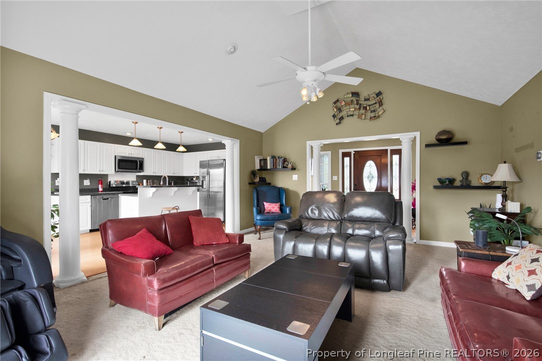 73 Timberlake Drive Clinton, NC 28328 - Photo 12 of 37 a living room with furniture and a chandelier