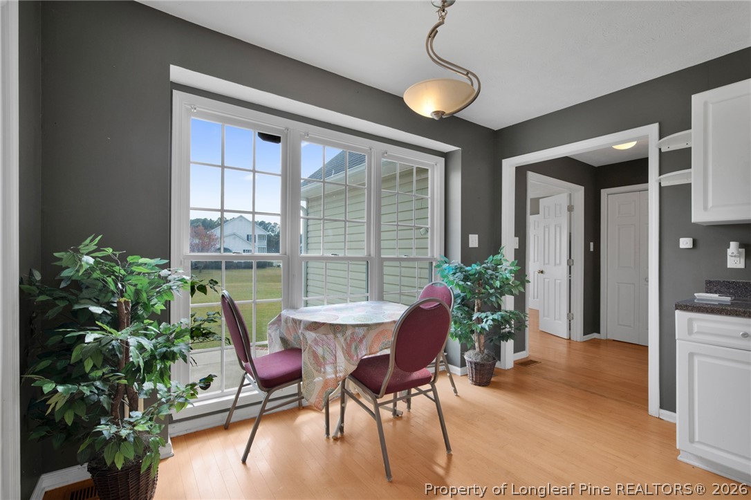 73 Timberlake Drive Clinton, NC 28328 - Photo 13 of 37 a dining room with furniture and a potted plant