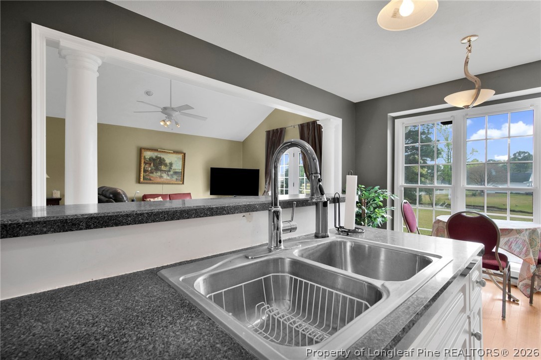 73 Timberlake Drive Clinton, NC 28328 - Photo 16 of 37 a kitchen with a sink and a refrigerator