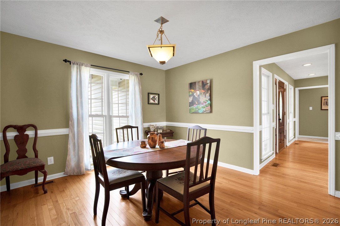 73 Timberlake Drive Clinton, NC 28328 - Photo 20 of 37 a view of a dining room with furniture window and wooden floor