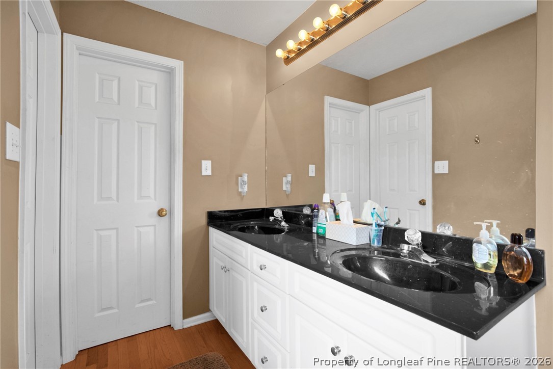 73 Timberlake Drive Clinton, NC 28328 - Photo 24 of 37 a kitchen with granite countertop a sink and cabinets