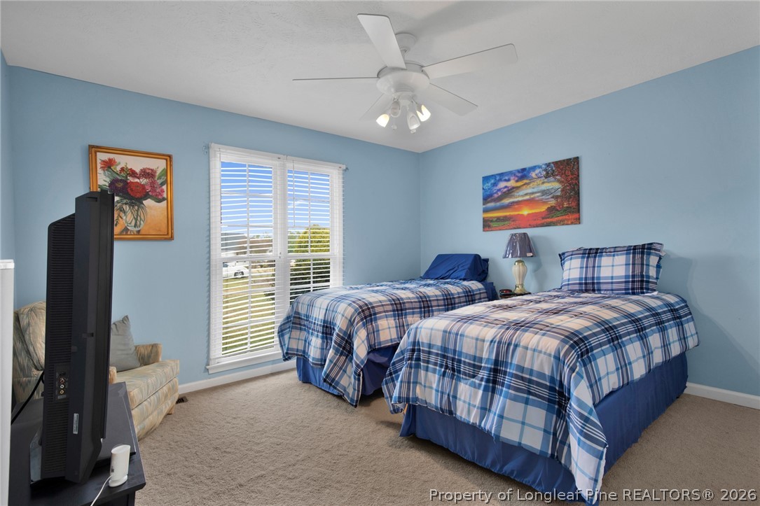 73 Timberlake Drive Clinton, NC 28328 - Photo 27 of 37 a bedroom with two beds and a window