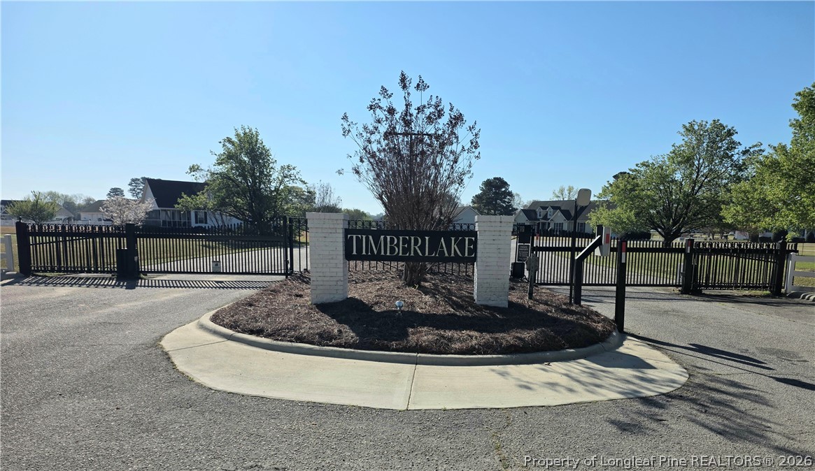 73 Timberlake Drive Clinton, NC 28328 - Photo 5 of 37 a view of a water fountain with tree in the background