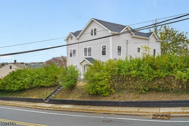a house with a white car parked