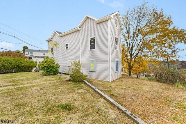 a view of a backyard of the house