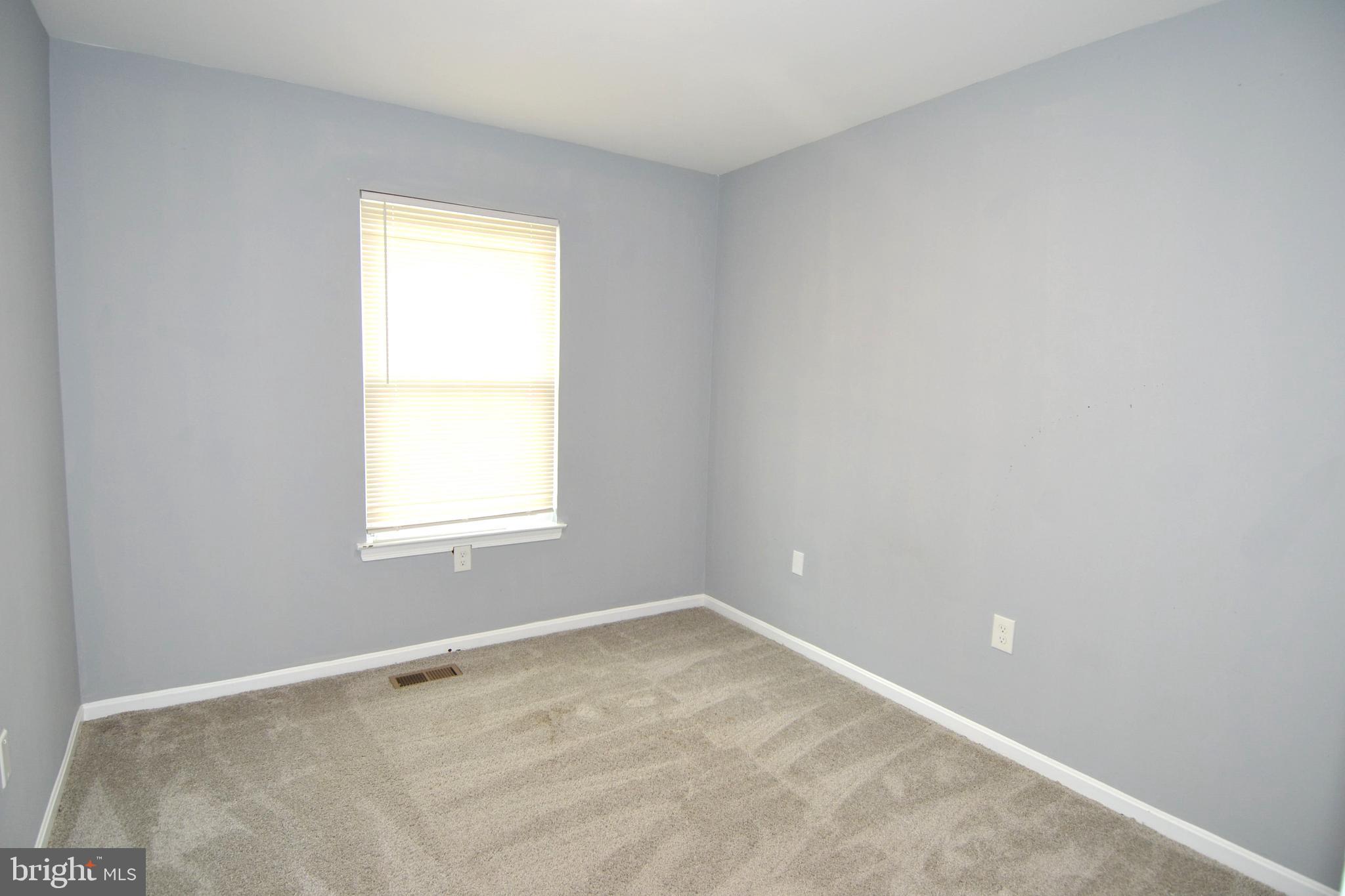 1465 Stoney Point Way Curtis Bay, MD 21226 - Photo 8 of 14 an empty room with a window
