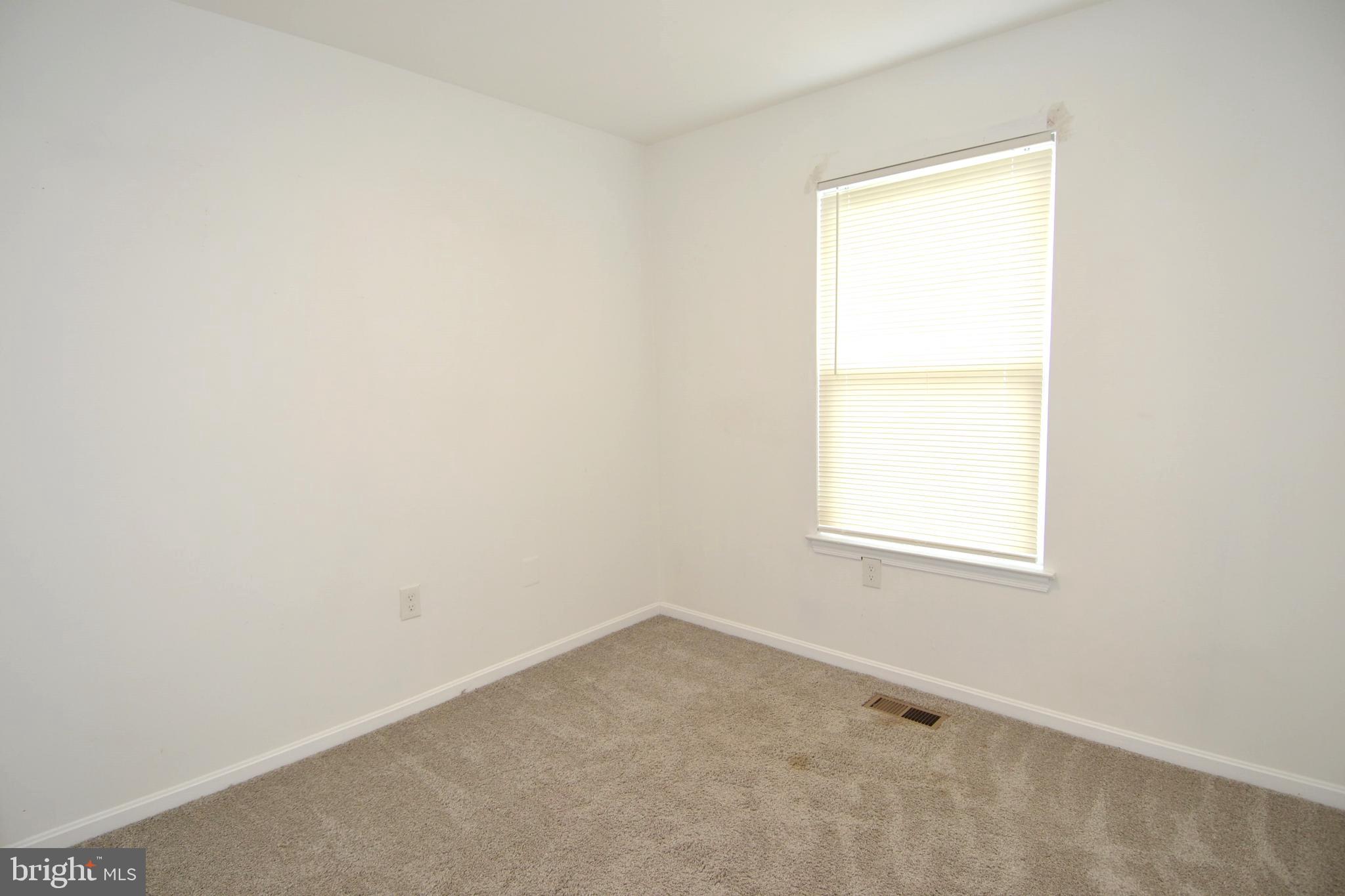 1465 Stoney Point Way Curtis Bay, MD 21226 - Photo 9 of 14 an empty room with a window