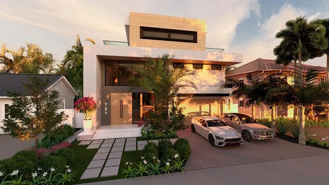 a couple of cars parked in front of a house