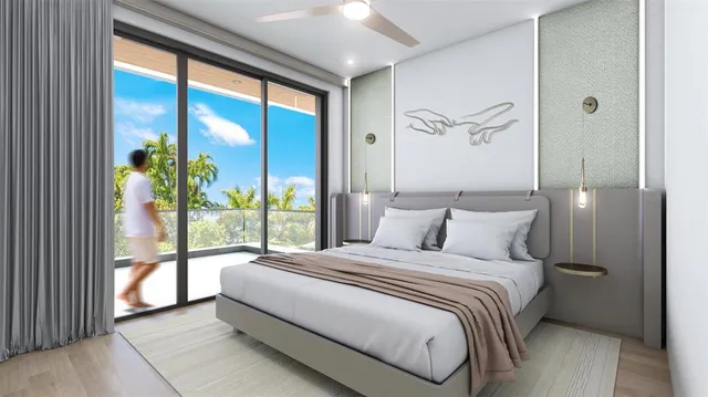 a bedroom with a large bed and a large window