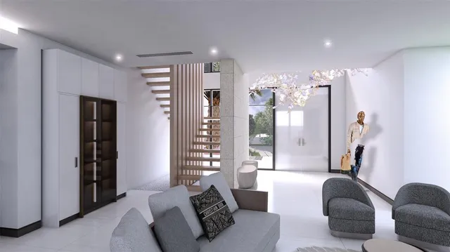 a living room with furniture and a chandelier