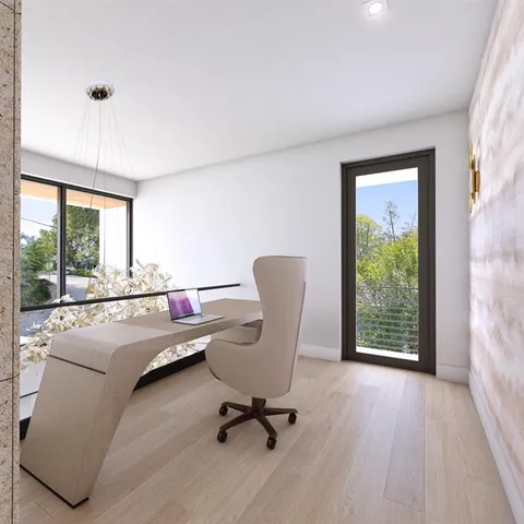 a view of workspace with a window and couch