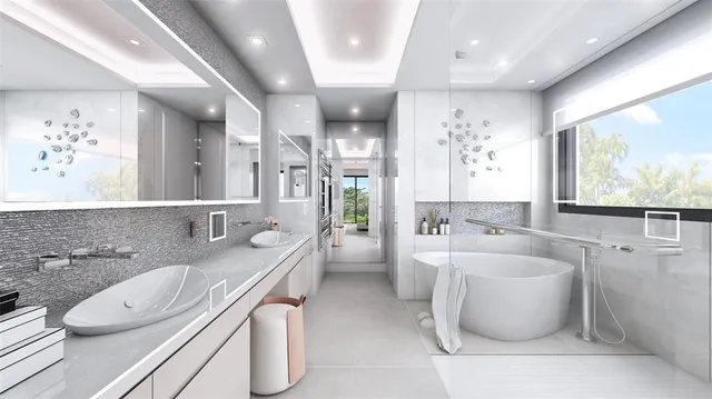 a bathroom with a granite countertop sink a large mirror and a bathtub