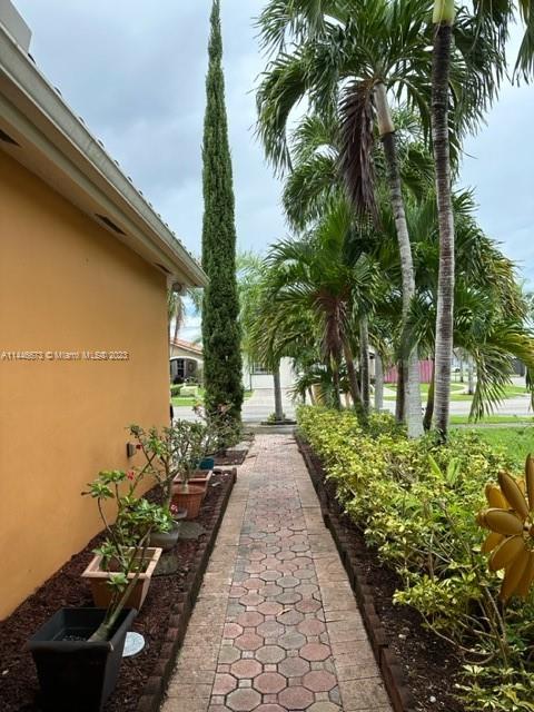 14636 Southwest 115th Terrace Miami, FL 33186 - Photo 3 of 12 a view of a backyard with potted plants