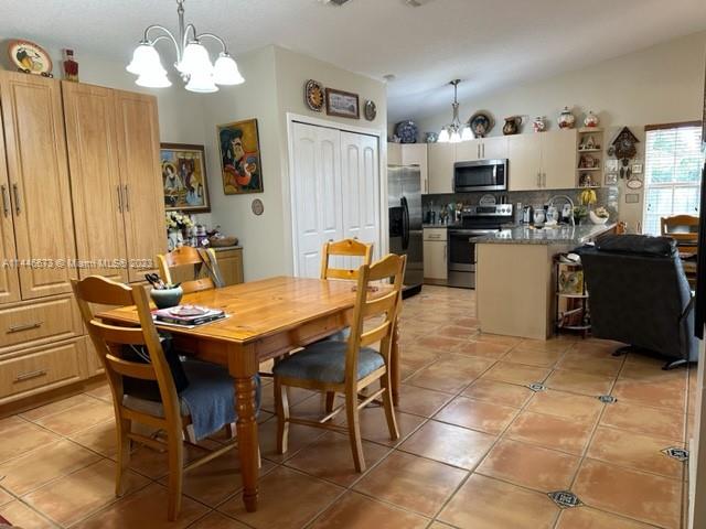 14636 Southwest 115th Terrace Miami, FL 33186 - Photo 8 of 12 a dining table chair and appliances