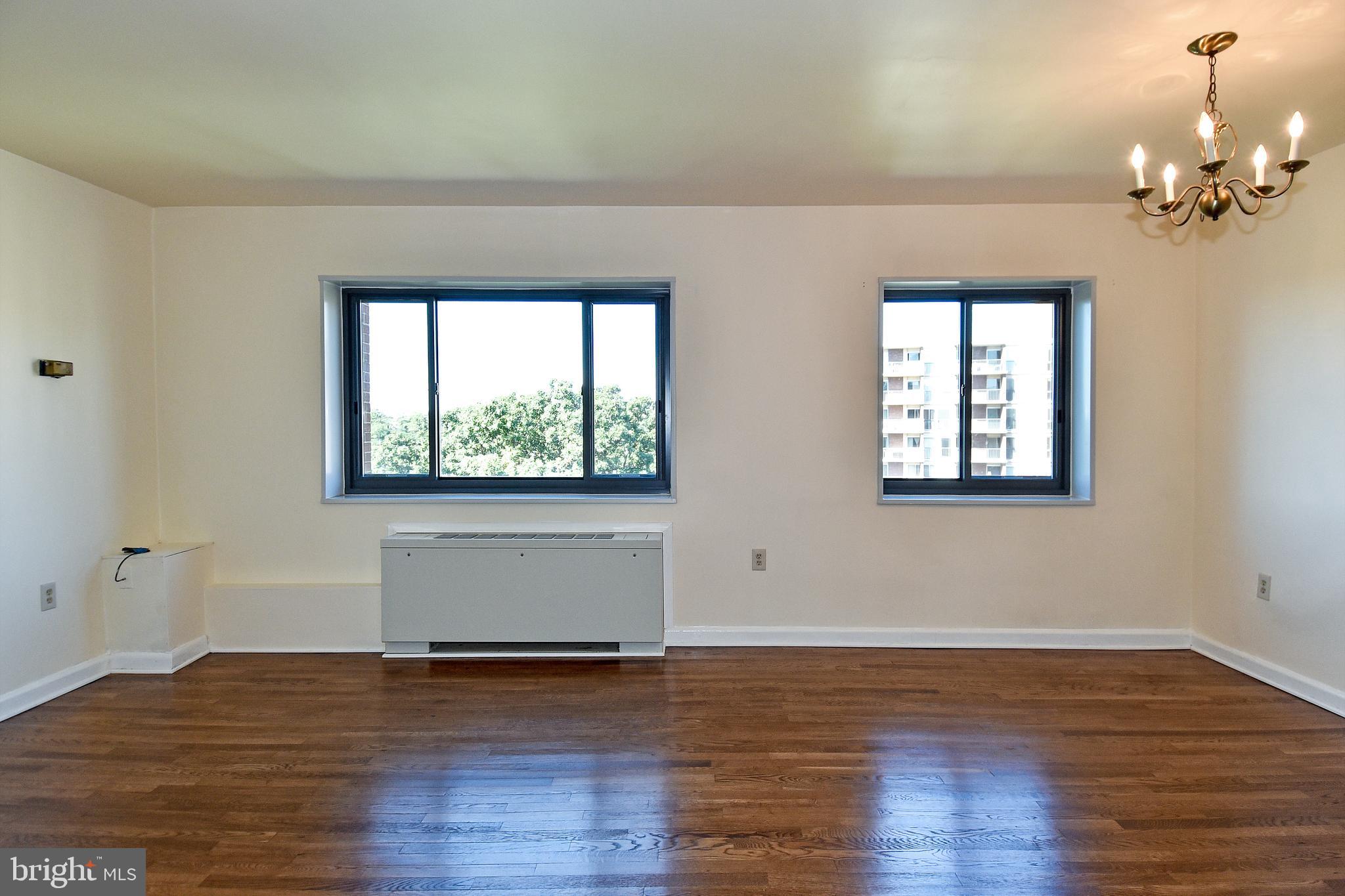 1200 South Arlington Ridge Road, Unit 703 Arlington, VA 22202 - Photo 11 of 38 Living to Dining Area with large windows