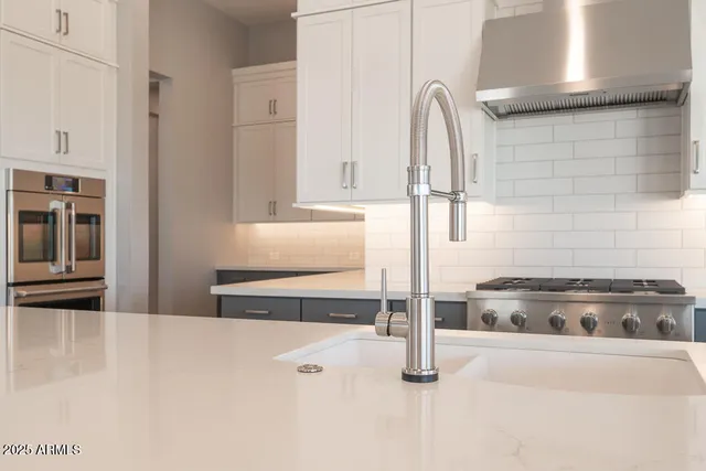 a close view of stove and tap