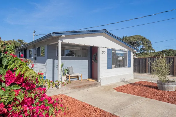 a front view of a house with an outdoor space