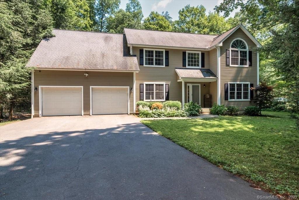 362 West Mountain Road Simsbury, CT 06092 - Photo 1 of 1 a front view of a house with a yard and garage