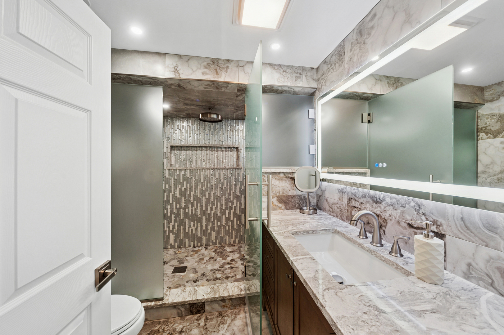 1772 Lancaster Way Northbrook, IL 60062 - Photo 12 of 26 a bathroom with a granite countertop bathtub sink vanity mirror and toilet