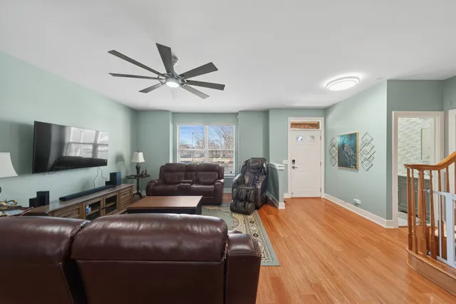 a bedroom with furniture and a flat screen tv