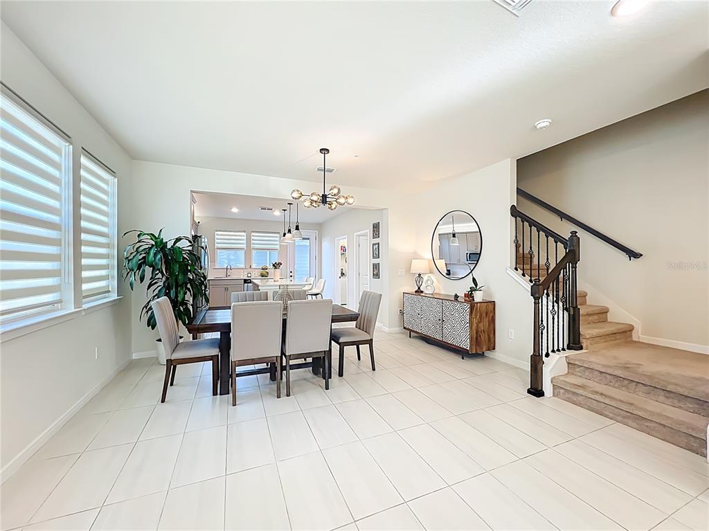 10976 Leafshore Loop Orlando, FL 32829 - Photo 14 of 70 a view of a livingroom with furniture and a table in it