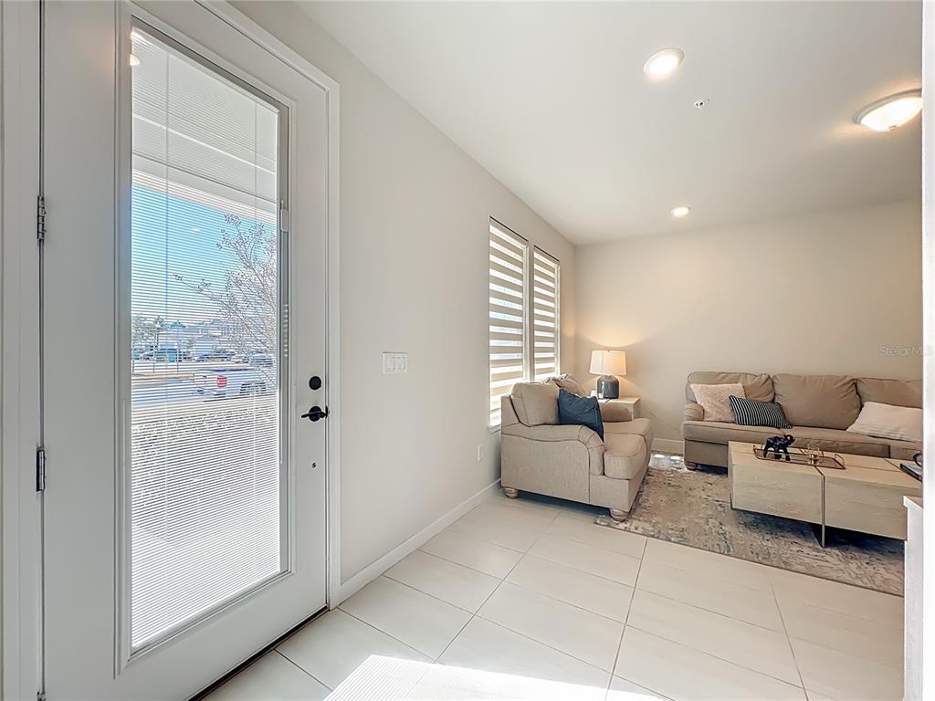 10976 Leafshore Loop Orlando, FL 32829 - Photo 5 of 70 a living room with furniture and a window