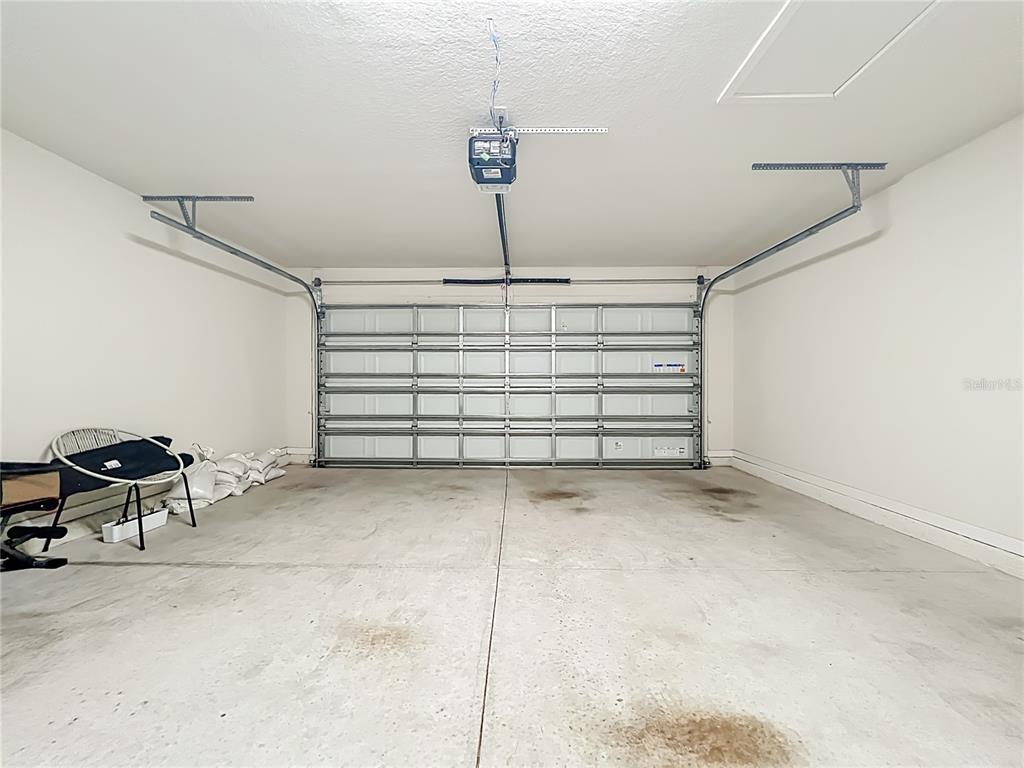 10976 Leafshore Loop Orlando, FL 32829 - Photo 53 of 70 a view of a room with a chair and lots of wooden cabinets
