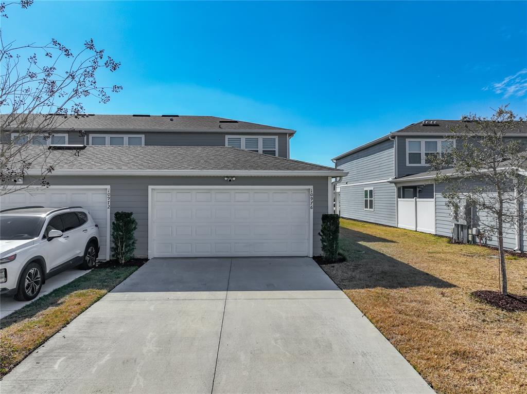 10976 Leafshore Loop Orlando, FL 32829 - Photo 65 of 70 a view of a car park in front of house
