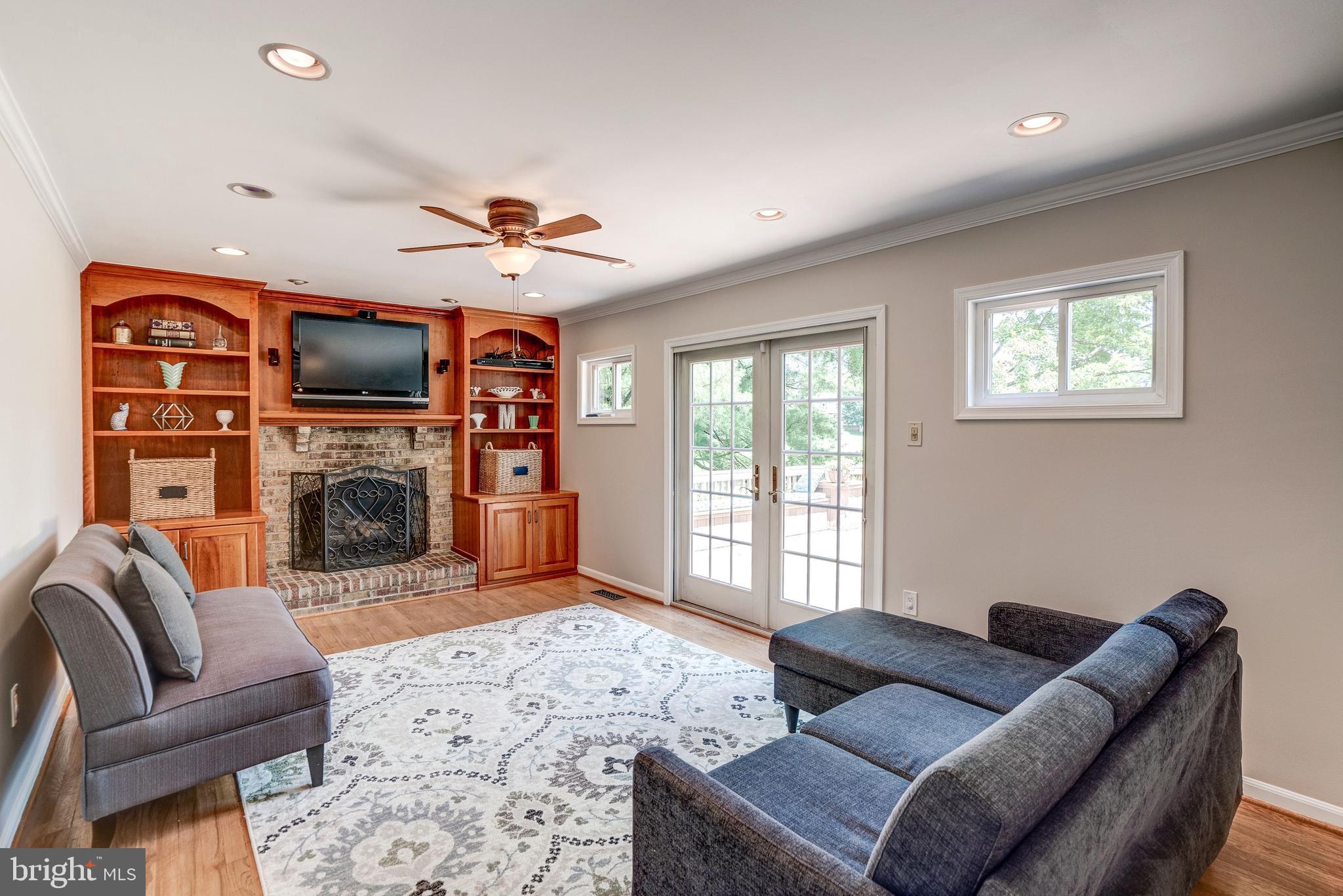 921 Riva Ridge Drive Great Falls, VA 22066 - Photo 18 of 44 propane fireplace flanked bybuilt-ins