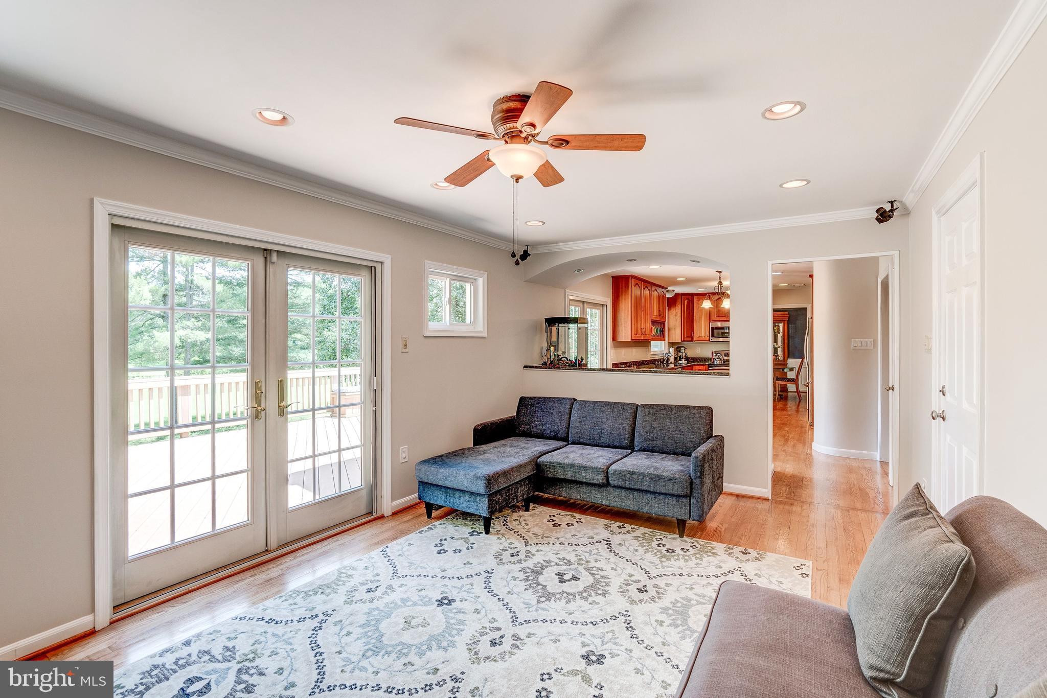 921 Riva Ridge Drive Great Falls, VA 22066 - Photo 20 of 44 comfortable family room with doors to deck