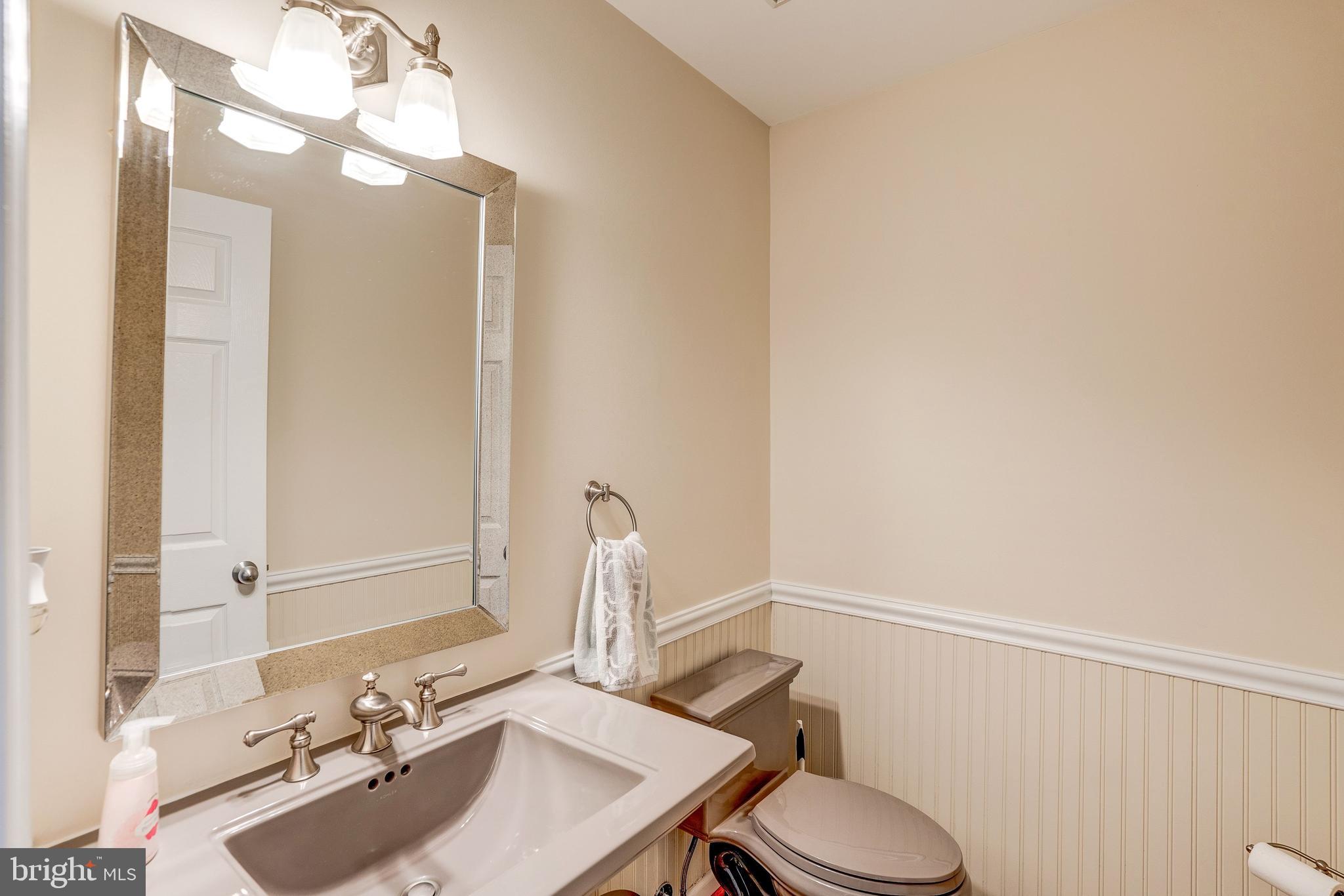 921 Riva Ridge Drive Great Falls, VA 22066 - Photo 22 of 44 main level powder room with stylish accessories
