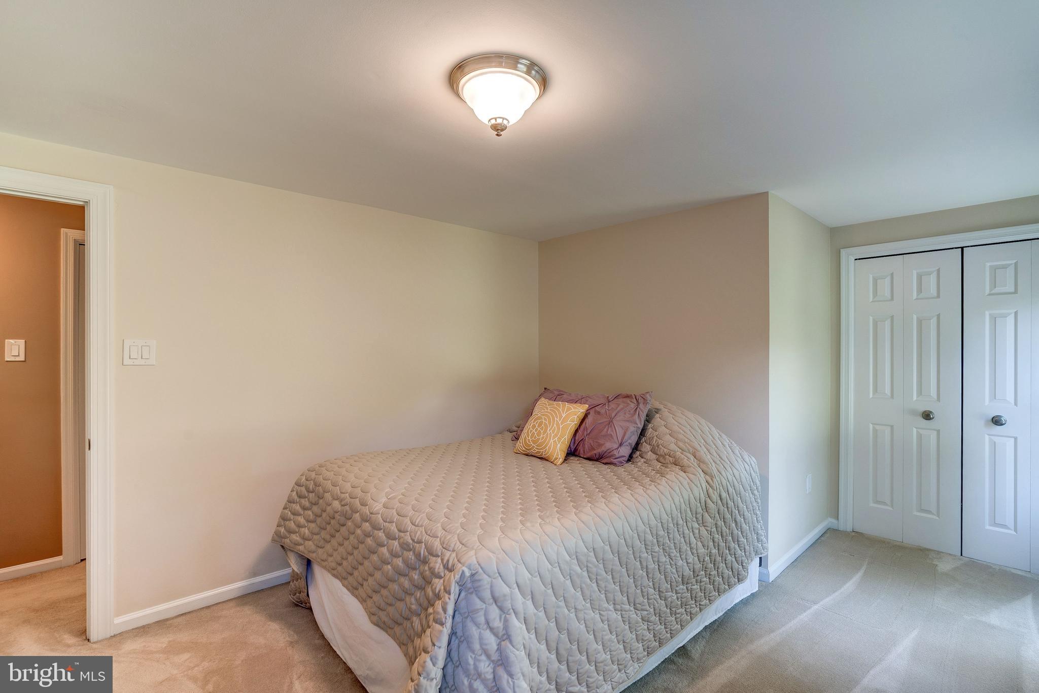 921 Riva Ridge Drive Great Falls, VA 22066 - Photo 29 of 44 double door closet in the second bedroom