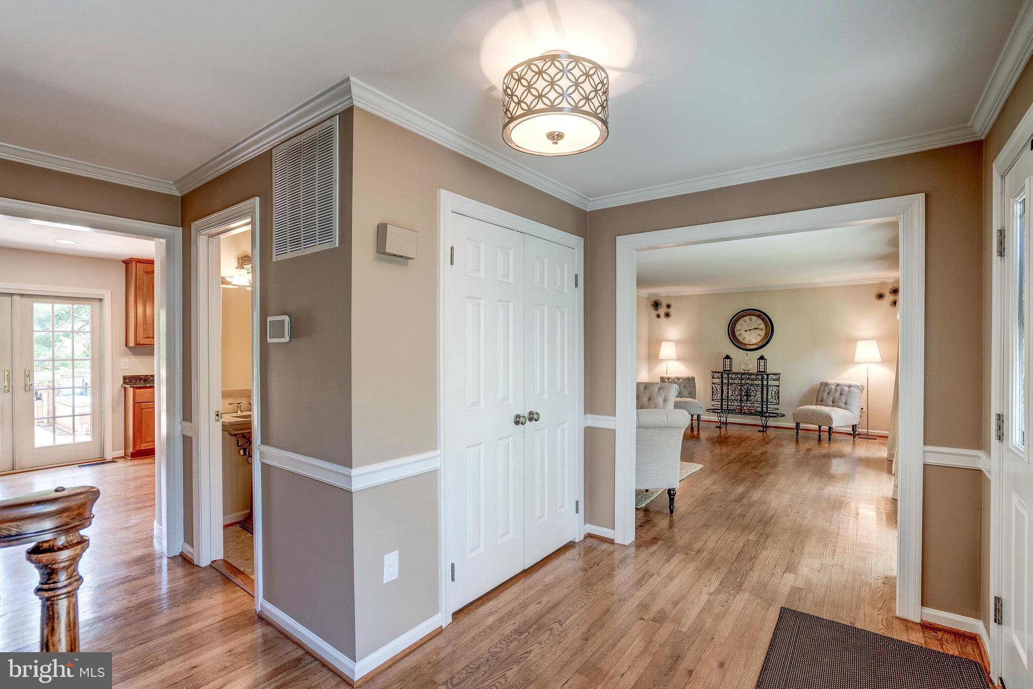 921 Riva Ridge Drive Great Falls, VA 22066 - Photo 4 of 44 inviting foyer opens to living room and kitchen