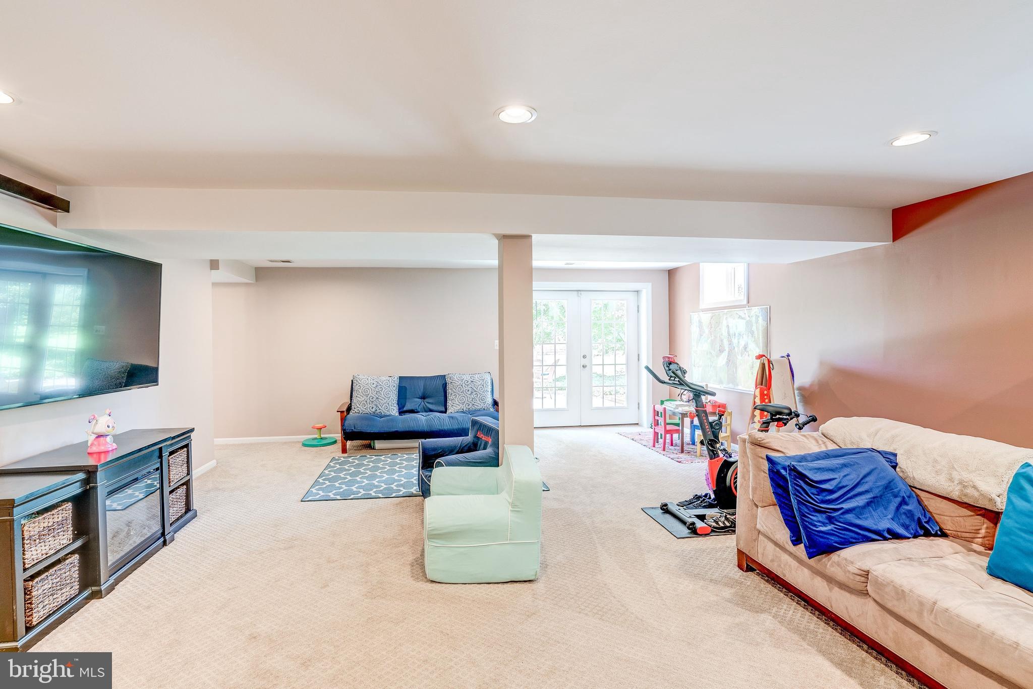 921 Riva Ridge Drive Great Falls, VA 22066 - Photo 36 of 44 doors to patio, recessed lighting brighten space