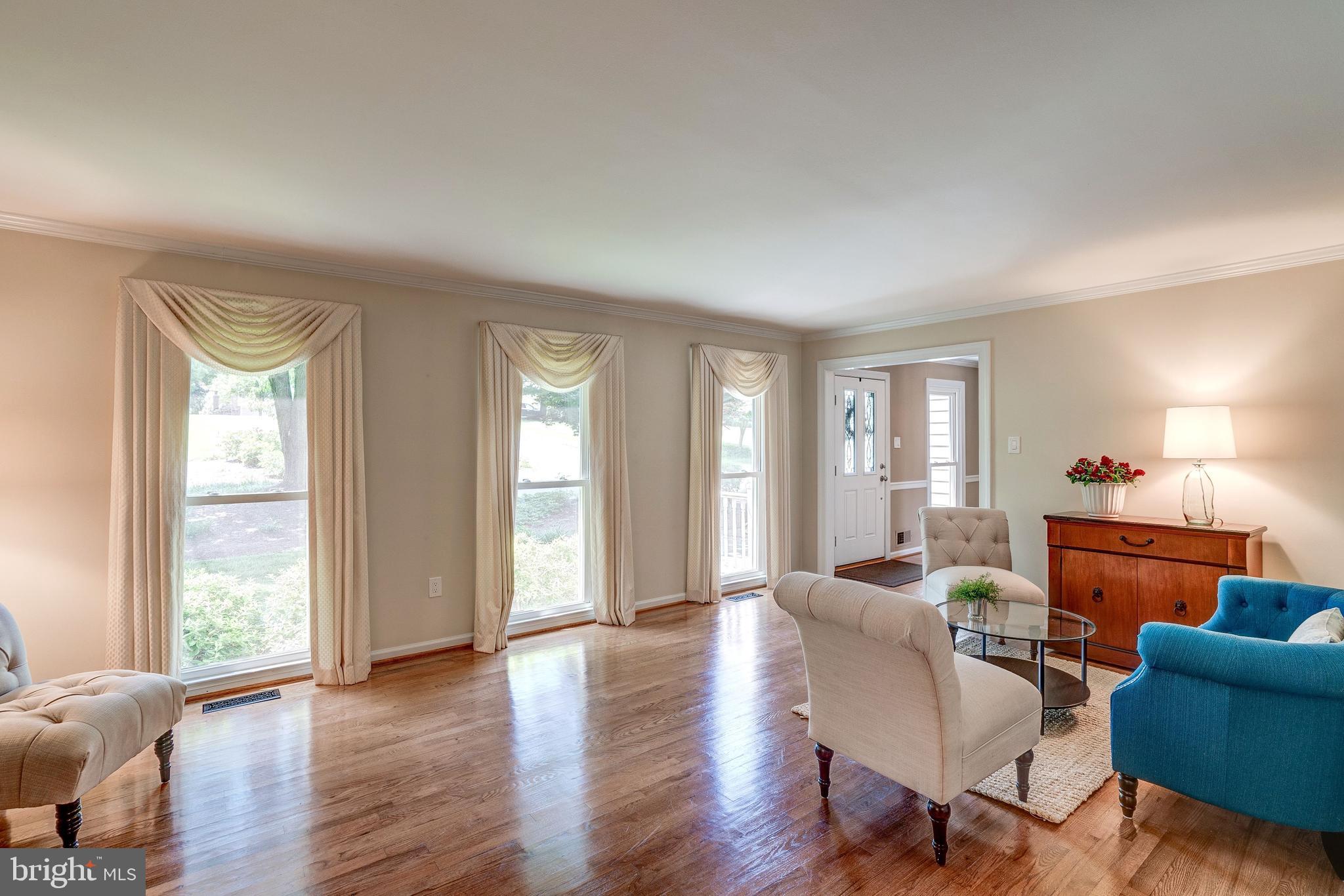 921 Riva Ridge Drive Great Falls, VA 22066 - Photo 6 of 44 floor to ceiling windows brighten the living room