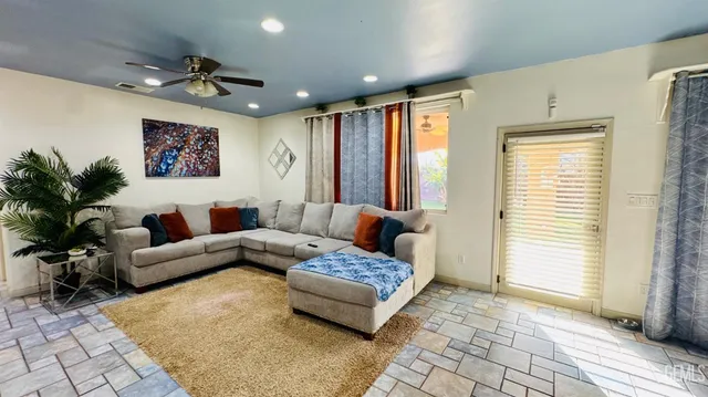 a living room with furniture and a window