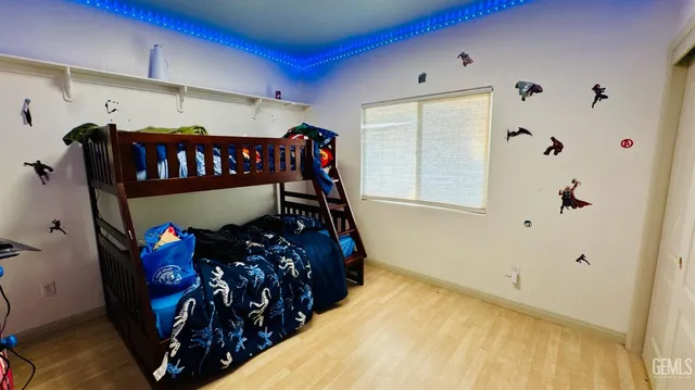 a bedroom with furniture with wooden floor