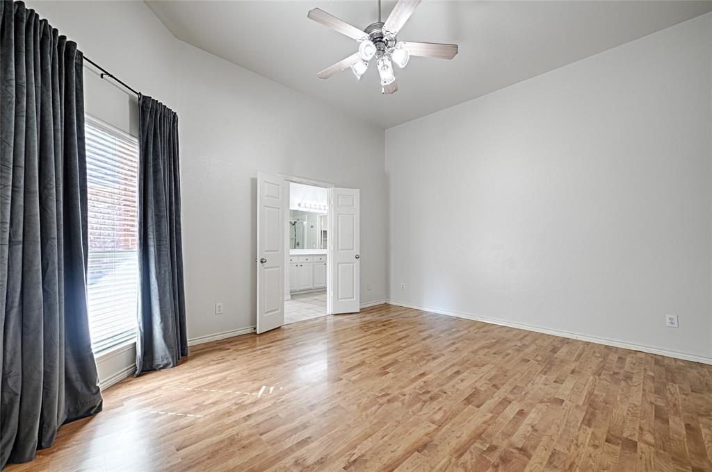 7681 Glasshouse Walk Frisco, TX 75035 - Photo 12 of 28 a view of empty room with wooden floor and fan