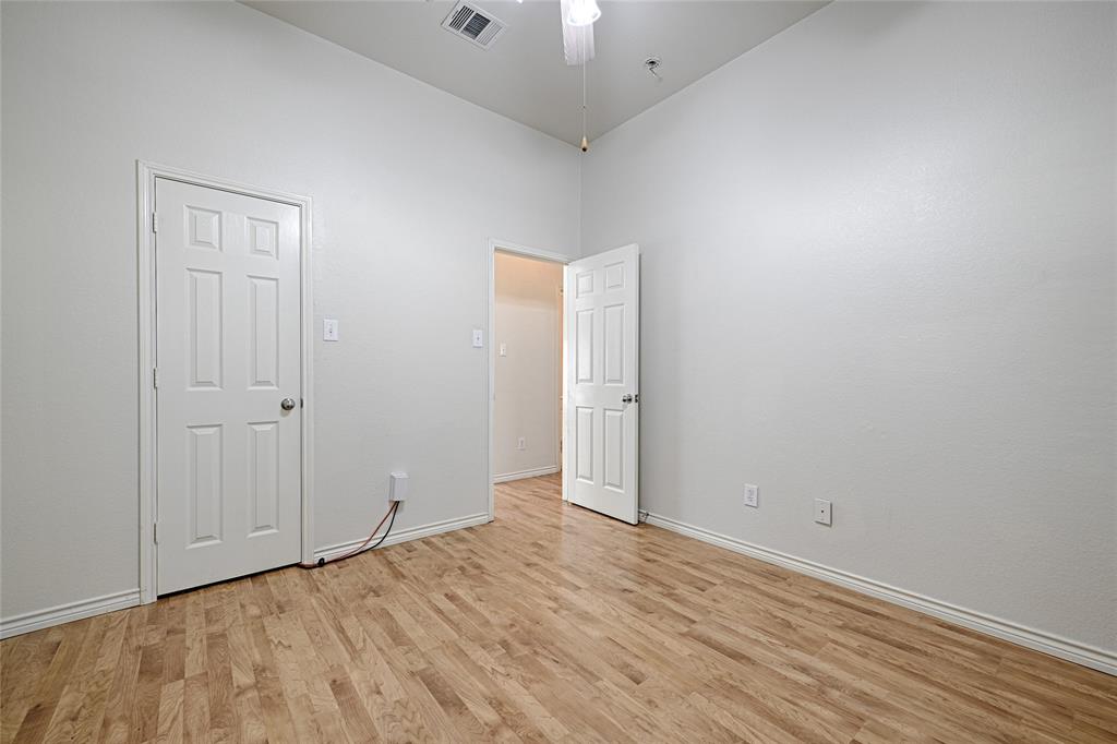 7681 Glasshouse Walk Frisco, TX 75035 - Photo 19 of 28 a view of an empty room with wooden floor