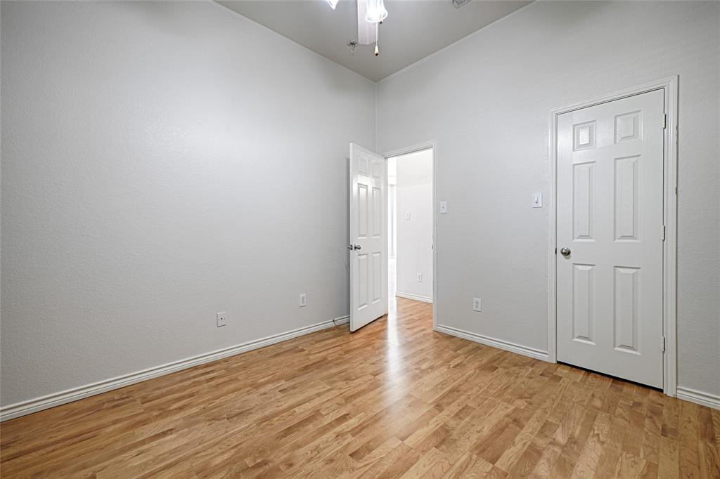 7681 Glasshouse Walk Frisco, TX 75035 - Photo 22 of 28 a view of an empty room with wooden floor