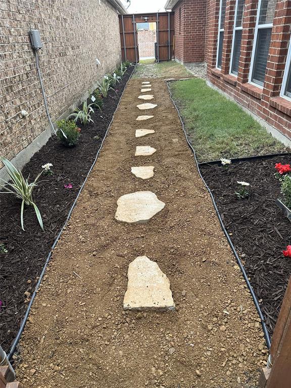 7681 Glasshouse Walk Frisco, TX 75035 - Photo 23 of 28 a view of a backyard with table and chairs