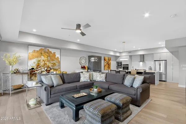 a living room with furniture and a large window