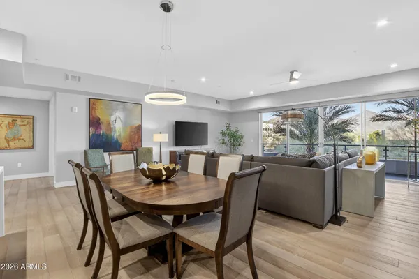a view of a dining room with furniture and wooden floor