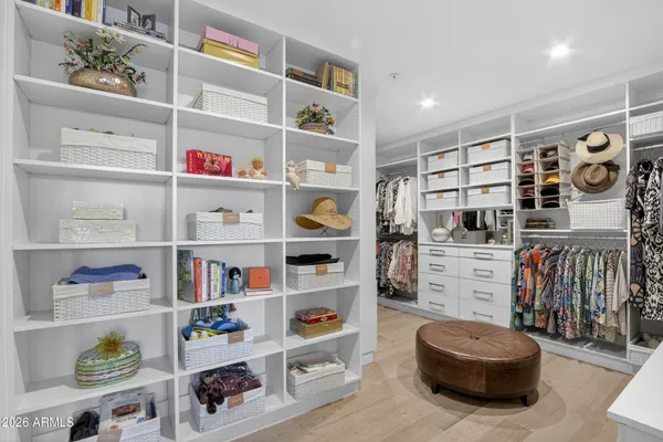 a living room with furniture and a book shelf
